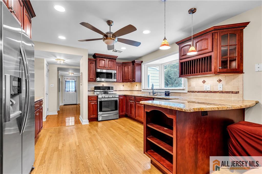 20 Oak Hills Road Edison, NJ 08820 - Photo 6 of 41 a open kitchen with stainless steel appliances granite countertop a stove refrigerator and a sink