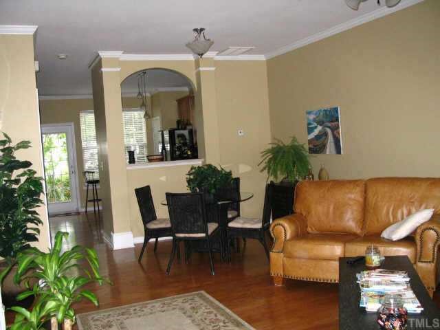 8344 City Loft Court Raleigh, NC 27613 - Photo 2 of 12 a living room with furniture and a mirror