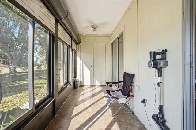 a view of a living room with furniture and a large window