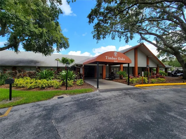 a view of a house with swimming pool and a yard
