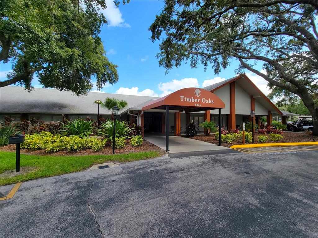 11203 Pembridge Court, Unit 1 Port Richey, FL 34668 - Photo 27 of 32 a view of a house with swimming pool and a yard