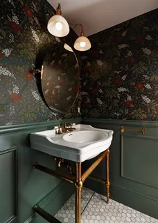 a bathroom with a sink a mirror and light fixture