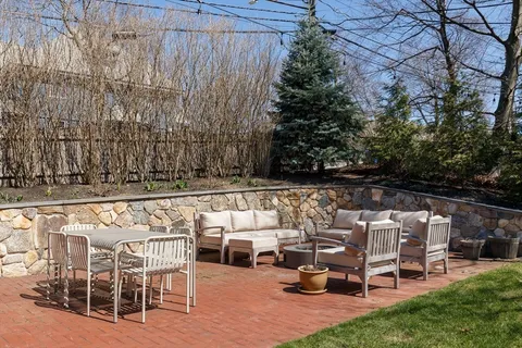 a view of house with backyard