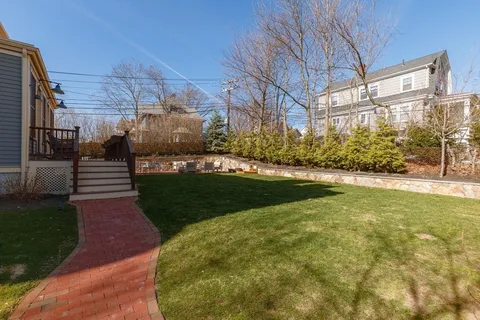 a view of balcony with wooden floor and outdoor seating