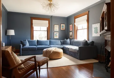 a living room with furniture a flat screen tv and a large window