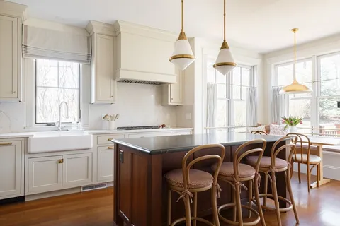 a view of a dining room with furniture and windows