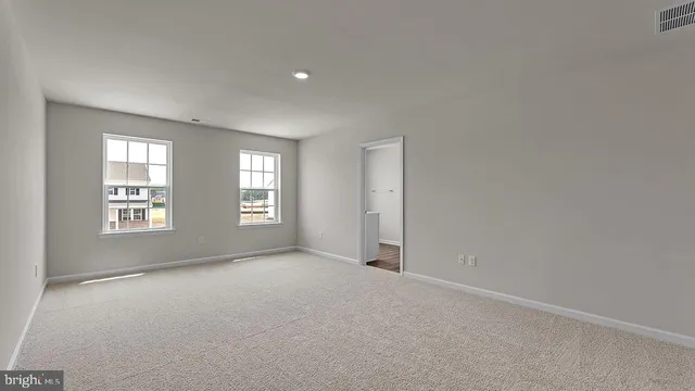 an empty room with windows