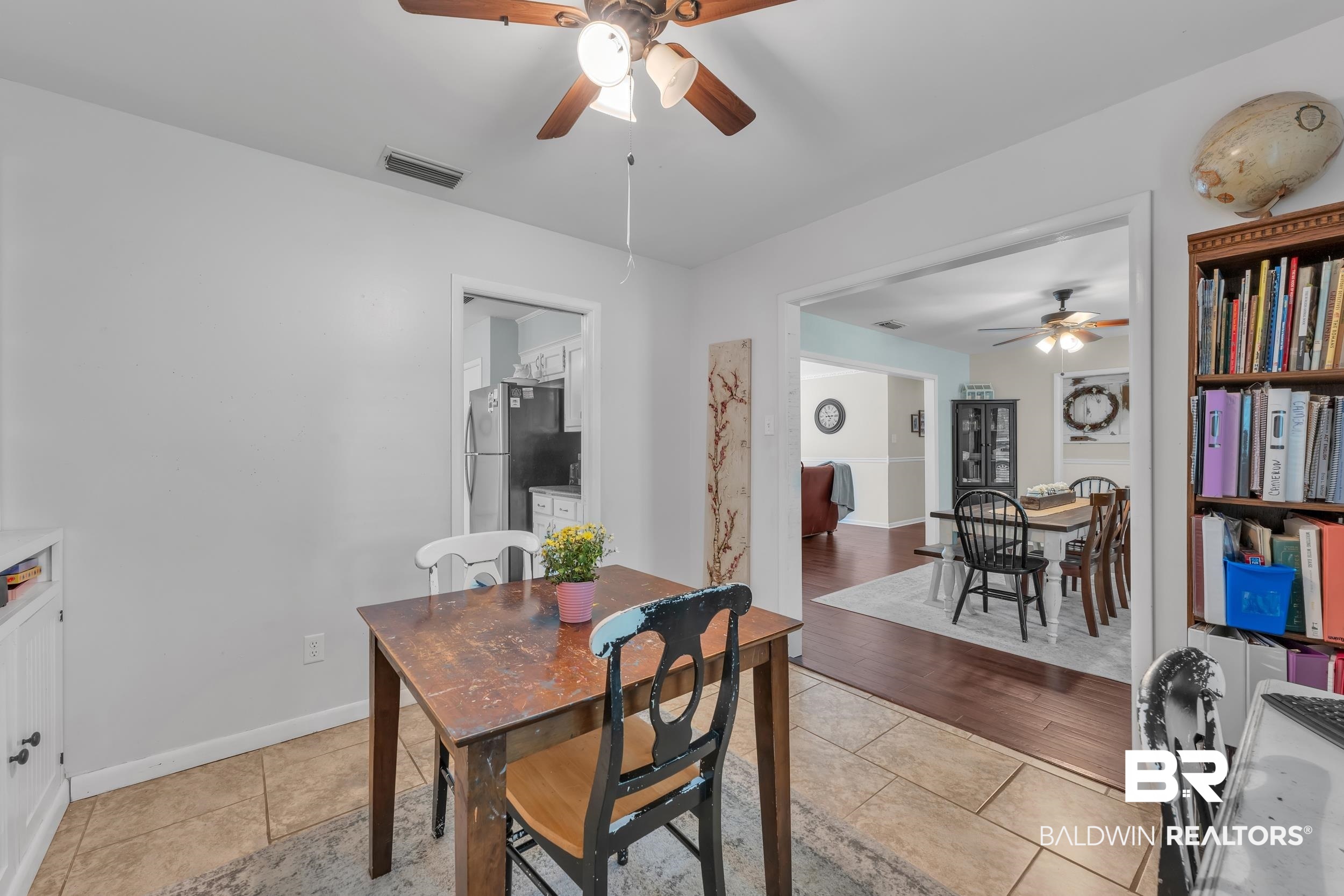 224 Cache Circle Mobile, AL 36611 - Photo 15 of 42 Dining room with a ceiling fan, baseboards, and light tile patterned floors