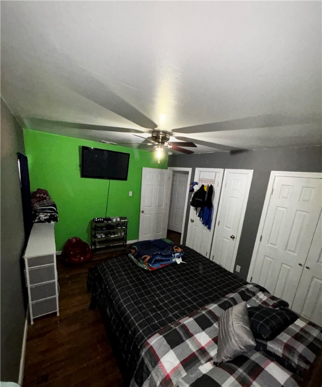 202 Coryell City Road Gatesville, TX 76528 - Photo 12 of 15 a bedroom with a bed and a chandelier