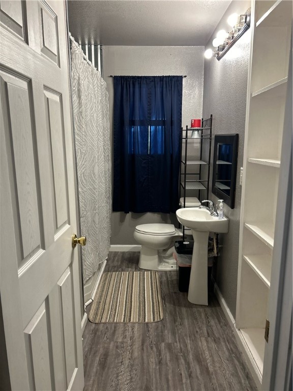 202 Coryell City Road Gatesville, TX 76528 - Photo 10 of 15 a bathroom with a sink a toilet and a mirror