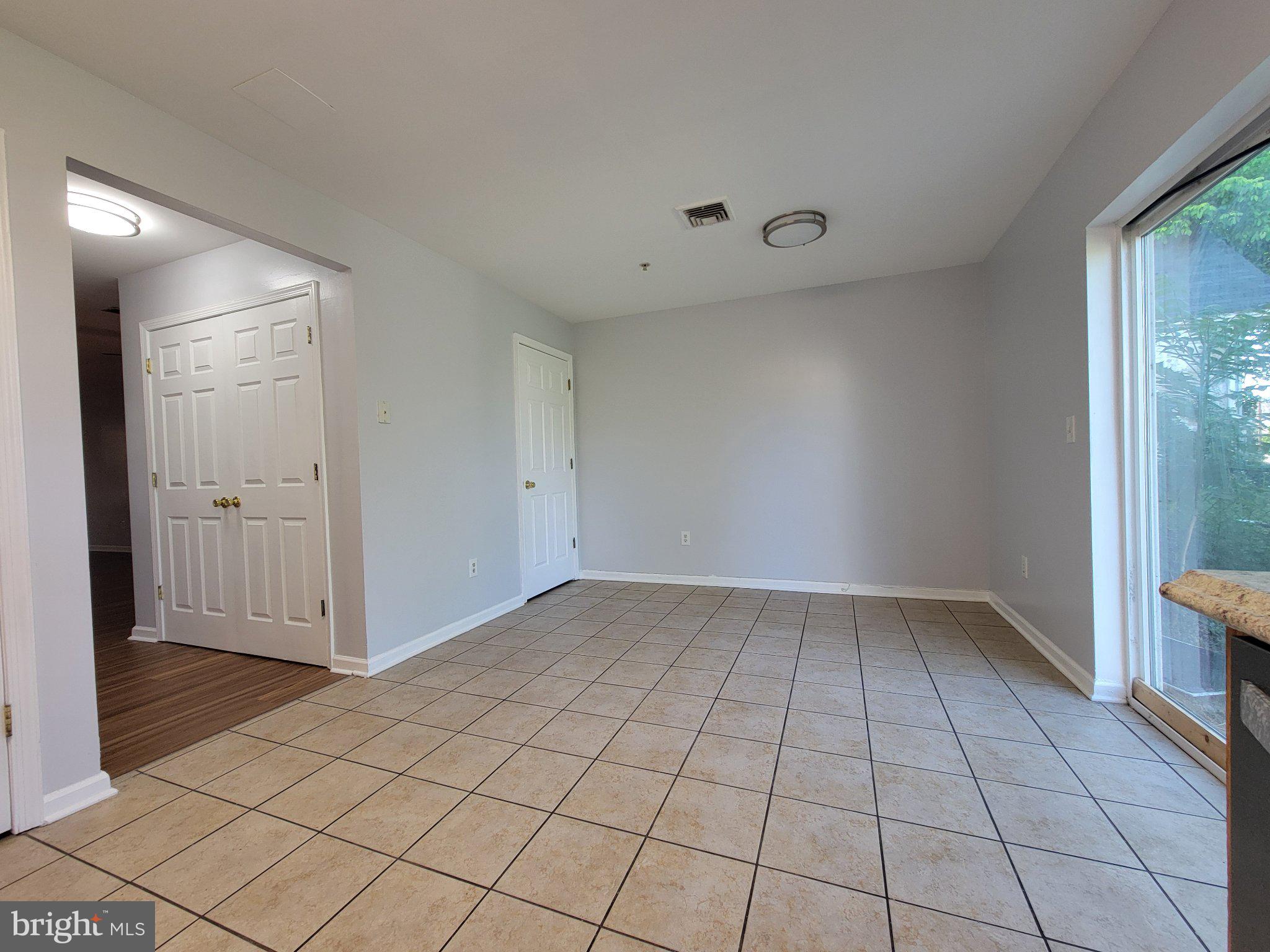 97 Spring Street Trenton, NJ 08618 - Photo 5 of 16 Spacious, light-filled living area.