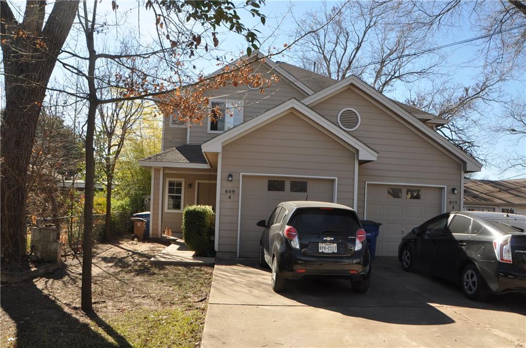 a view of a car park in front of house
