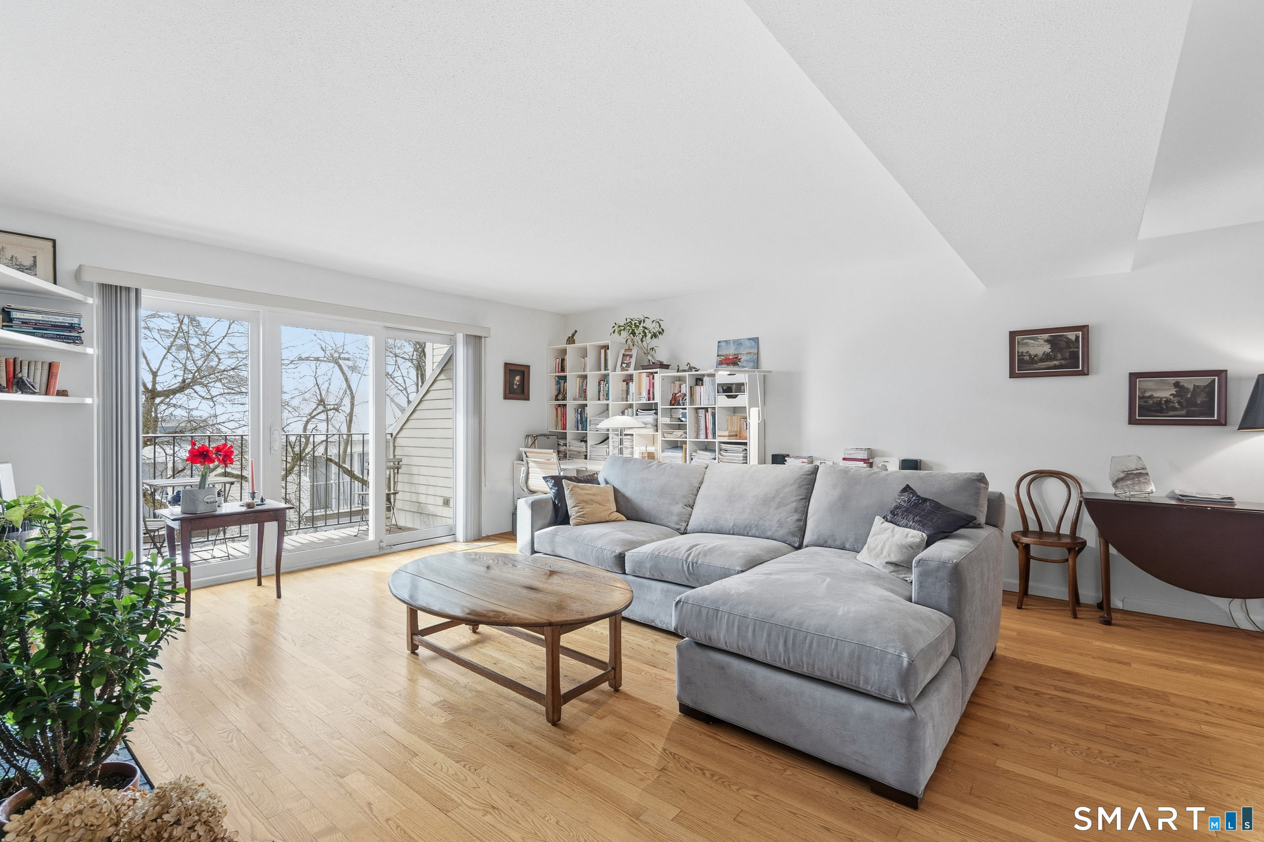 91 Highland Road, Unit 91 Stamford, CT 06901 - Photo 6 of 15 a living room with furniture and a wooden floor