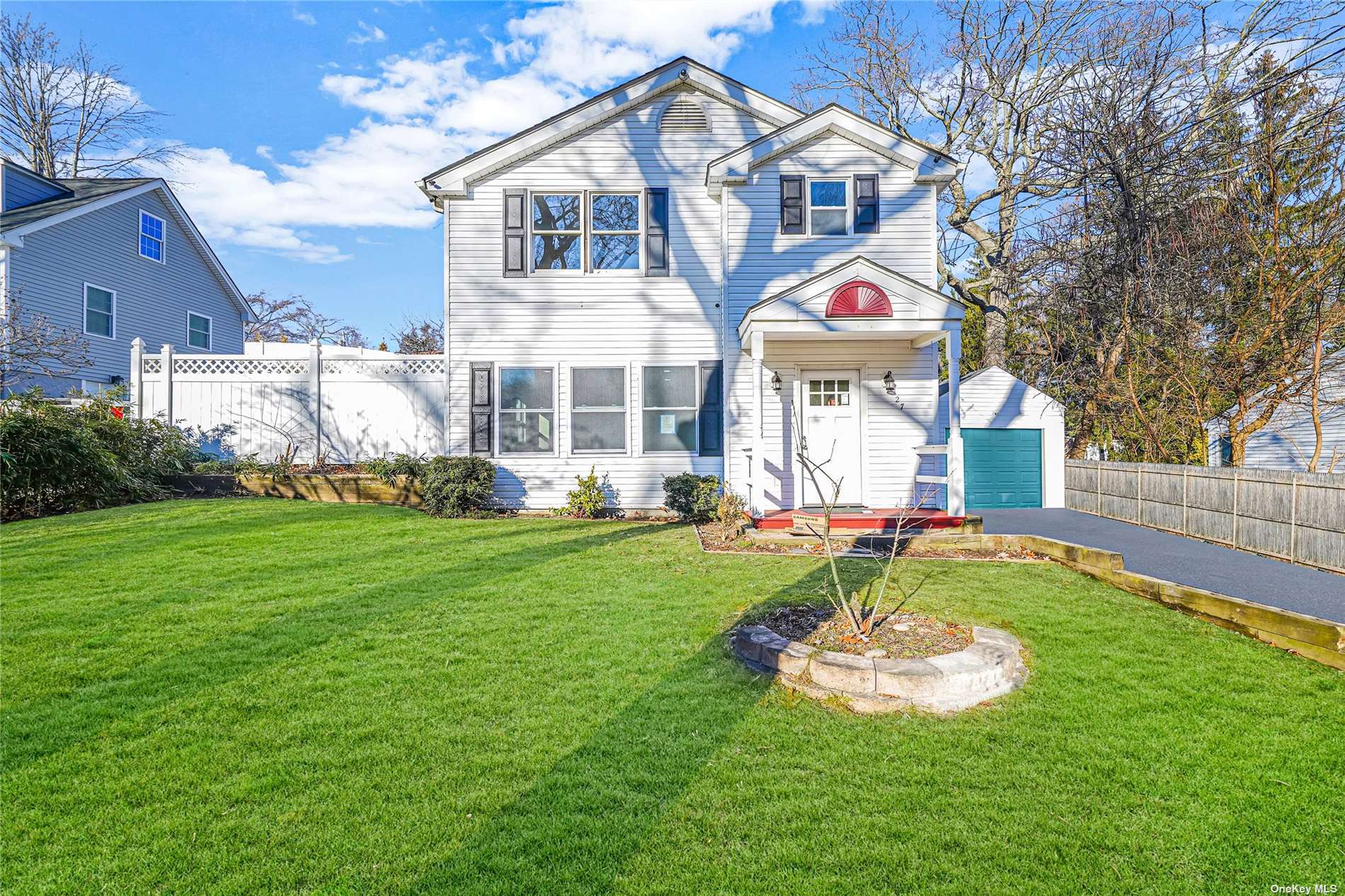 27 Garden Road Sound Beach, NY 11789 - Photo 1 of 1 a front view of house with yard and outdoor seating