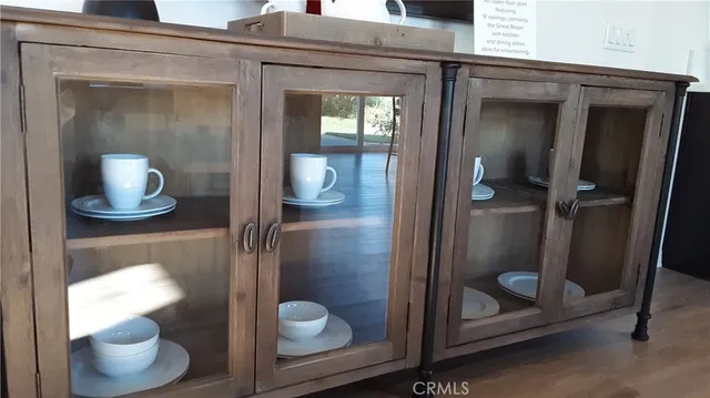 a bathroom with a toilet and a mirror