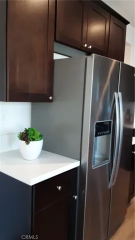 a kitchen with a sink and stainless steel appliances