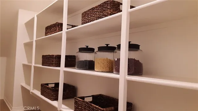 a view of a workspace with furniture and wooden floor