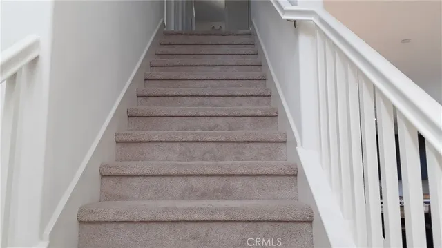 a bed room with a bed and a lamp