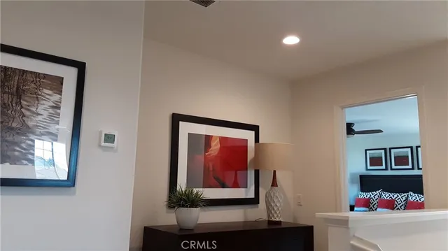 a view of a hallway with a potted plant