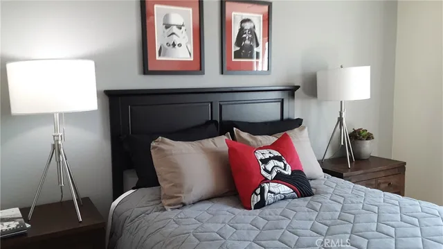 a bedroom with a bed and with furniture