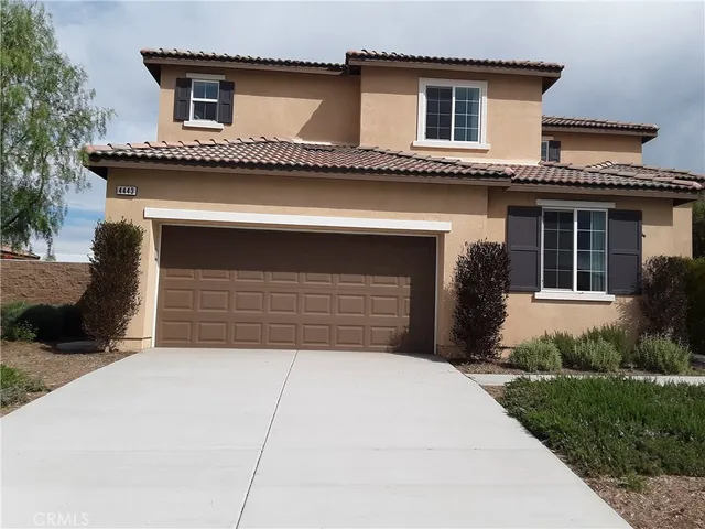 a front view of a house with a garage