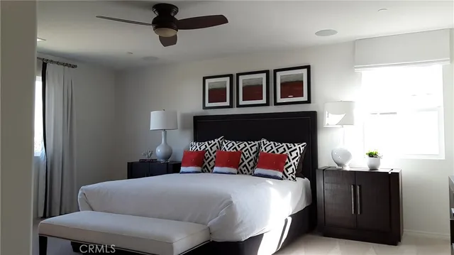 a bedroom with a bed and window