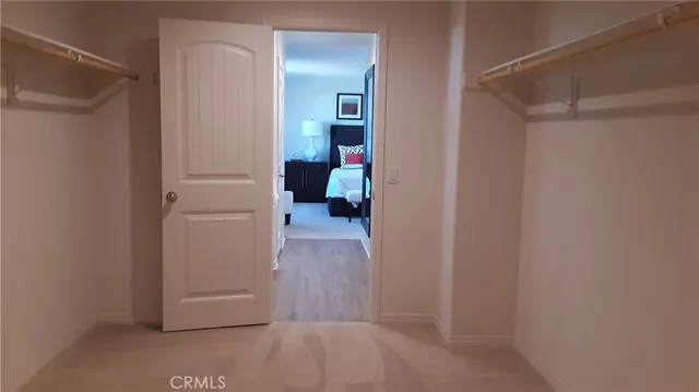 a bedroom with a bed and a lamp