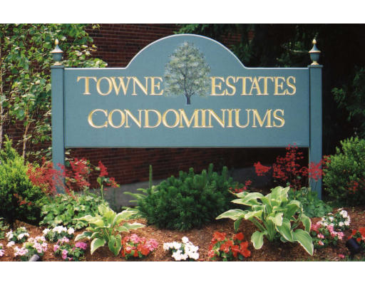 a sign broad in front of flowers