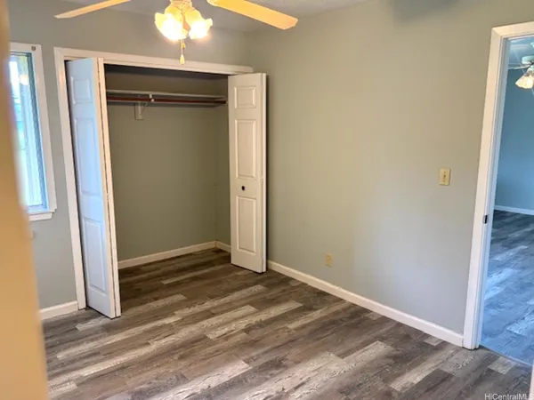 an empty room that has a mirror in it