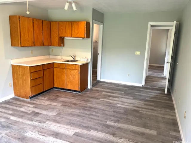 a view of kitchen with wooden floor