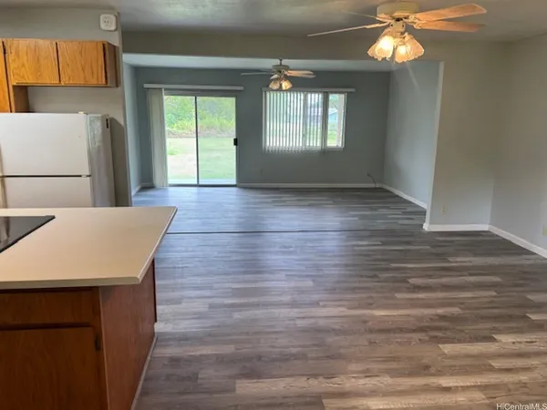a room with wooden floor and window