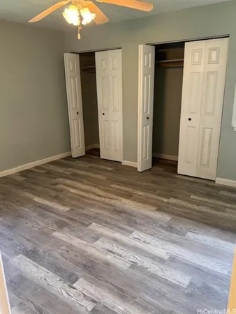 a view of a livingroom with wooden floor