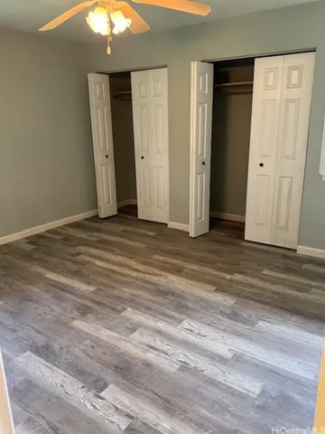 a view of a livingroom with wooden floor