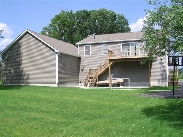 13 Black Point Road Webster, MA 01570 - Photo 3 of 22 a big house with a big yard and more large trees