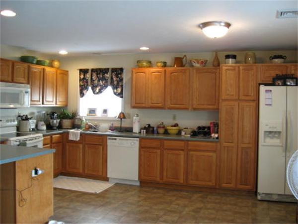 13 Black Point Road Webster, MA 01570 - Photo 6 of 22 a kitchen with granite countertop a sink a counter space appliances and cabinets