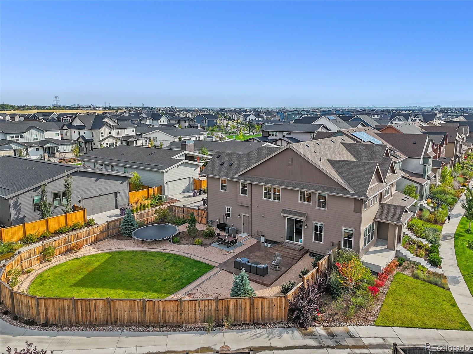 6374 North Fulton Street Denver, CO 80238 - Photo 1 of 49 an aerial view of a house with a garden and trees