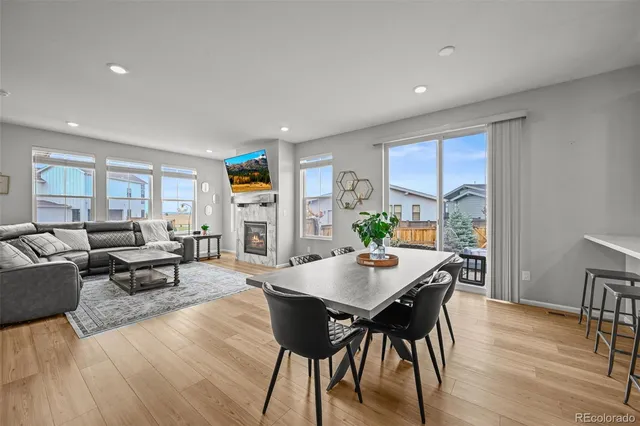 a view of a dining room with furniture window and wooden floor