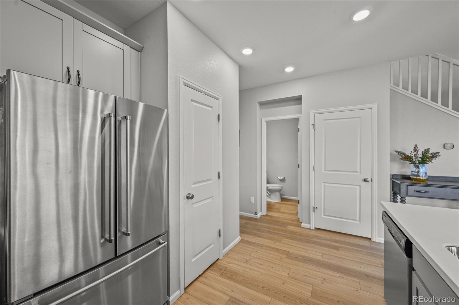 6374 North Fulton Street Denver, CO 80238 - Photo 15 of 49 a view of a hallway with wooden floor and staircase