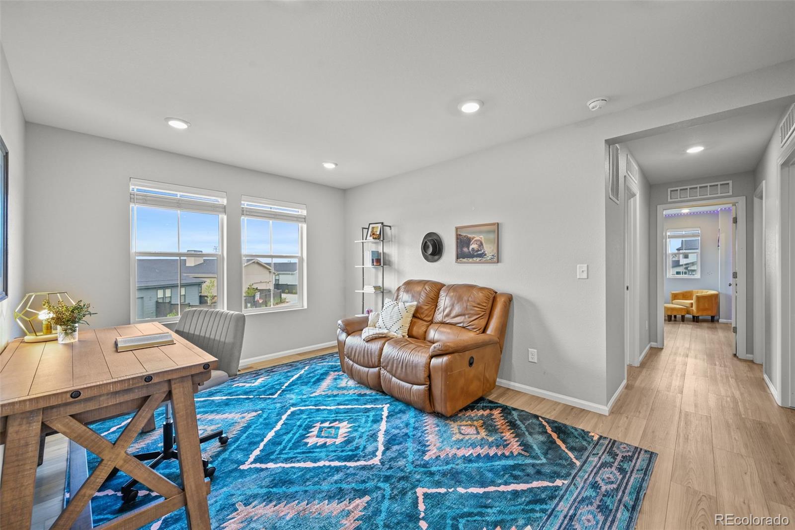 6374 North Fulton Street Denver, CO 80238 - Photo 19 of 49 a living room with furniture and a table