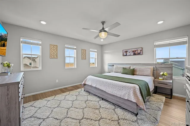 a spacious bedroom with a bed and a window