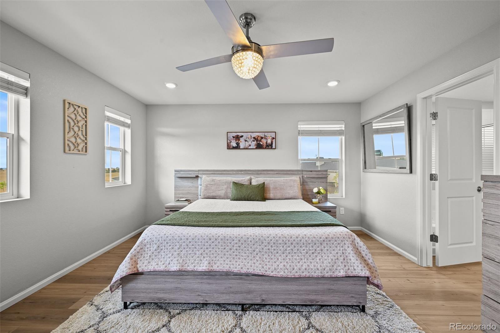 6374 North Fulton Street Denver, CO 80238 - Photo 21 of 49 a bedroom with a bed and painting on the wall