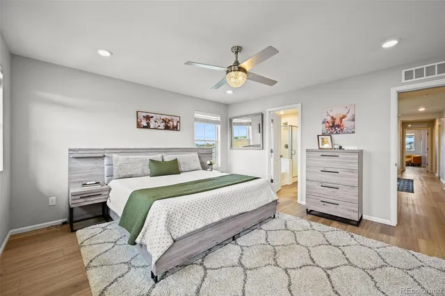 a bedroom with a bed and a cabinets