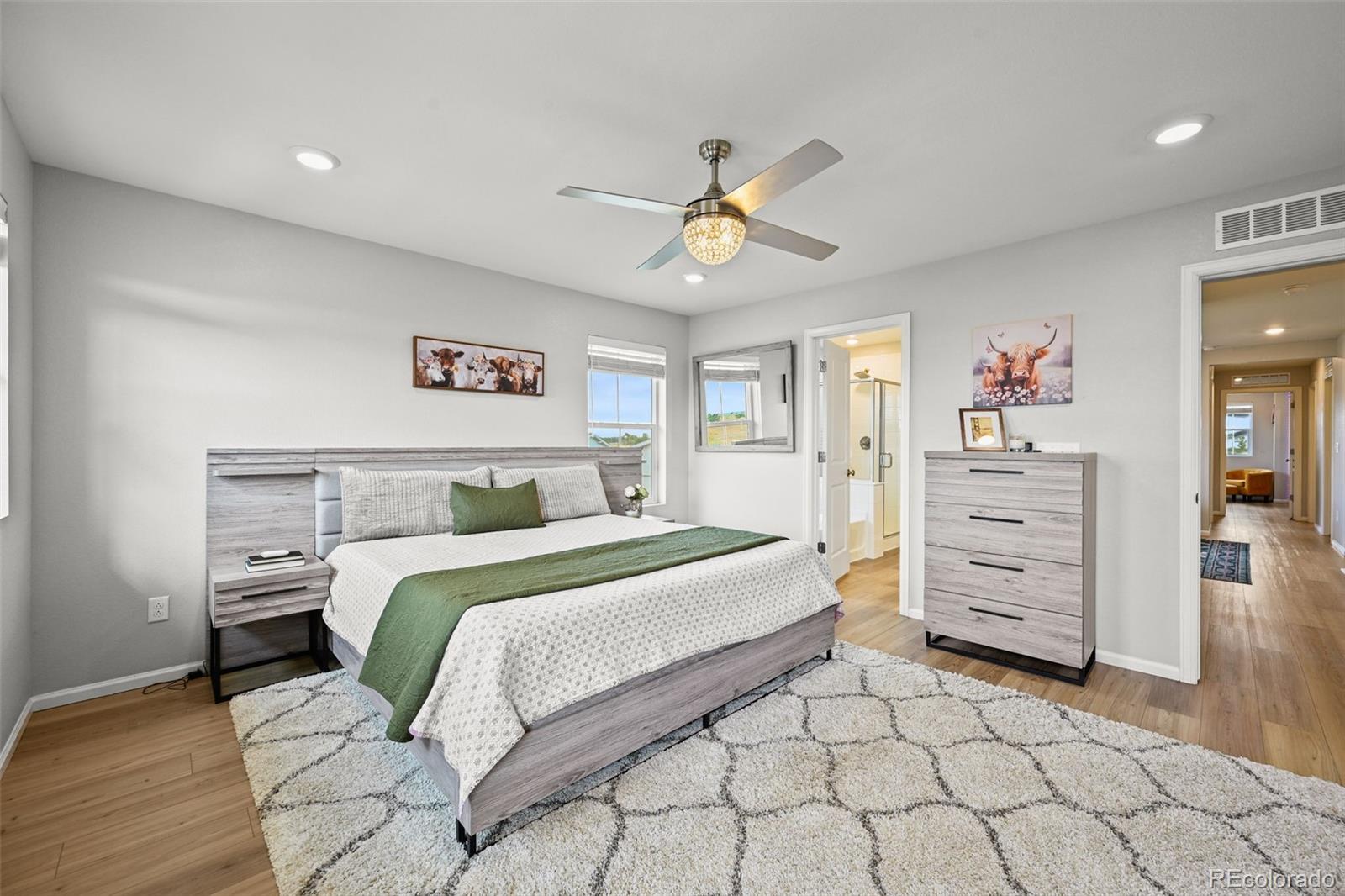 6374 North Fulton Street Denver, CO 80238 - Photo 22 of 49 a bedroom with a bed and a cabinets