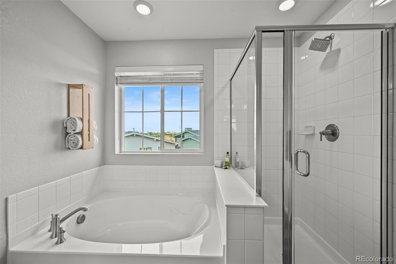 6374 North Fulton Street Denver, CO 80238 - Photo 24 of 49 a bathroom with a bath tub and a shower