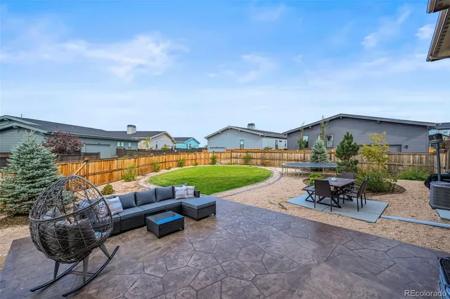 a view of a house with outdoor space and a lake view