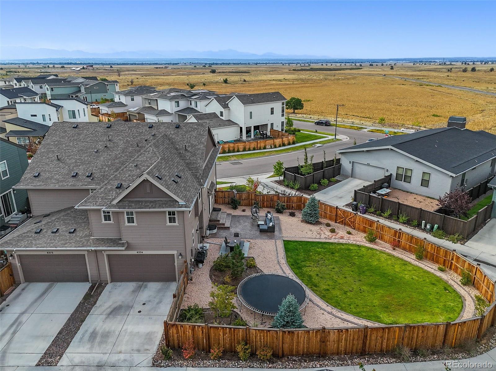 6374 North Fulton Street Denver, CO 80238 - Photo 40 of 49 an aerial view of residential houses with outdoor space and ocean view