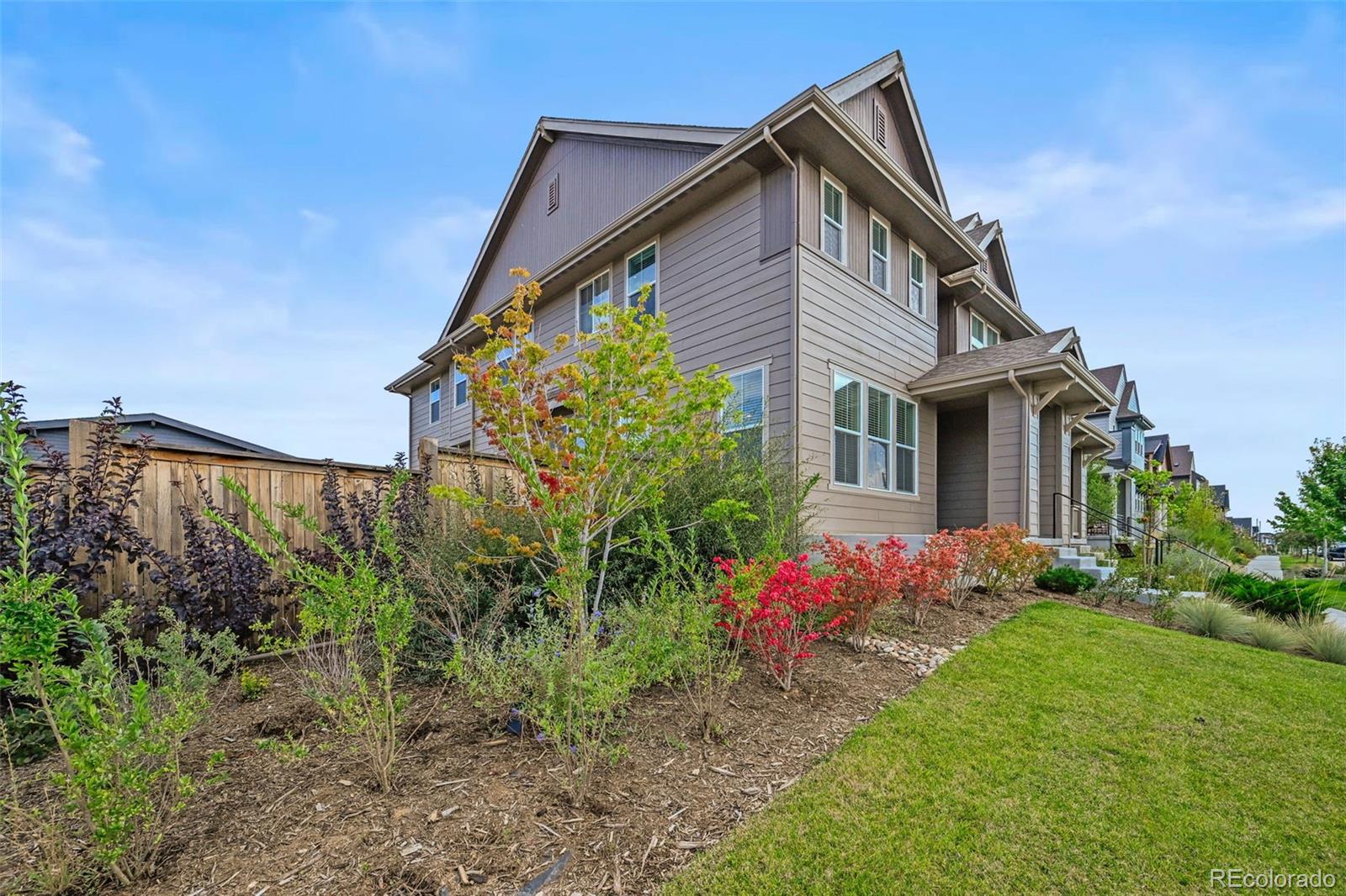 6374 North Fulton Street Denver, CO 80238 - Photo 4 of 49 a front view of a house with garden