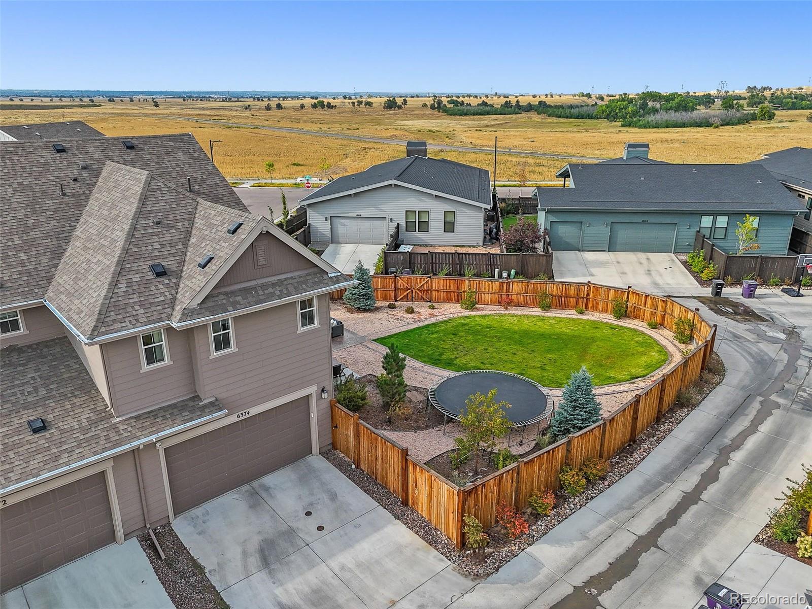 6374 North Fulton Street Denver, CO 80238 - Photo 41 of 49 a view of a house with outdoor space and a lake view