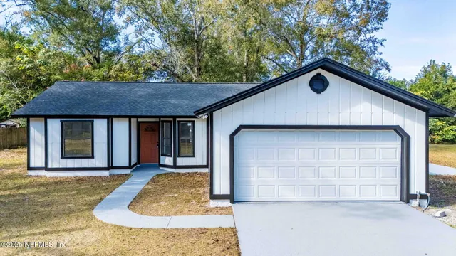 a front view of a house with garage