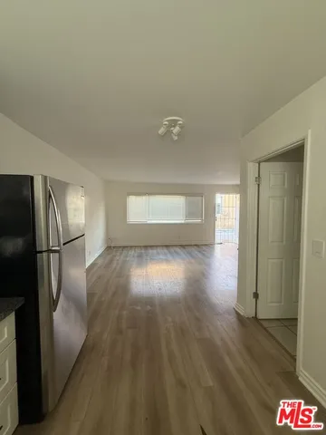 a stove top oven sitting inside of a kitchen
